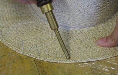 Pinning brim edge using a pin pusher for blocking in one